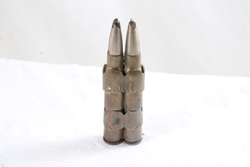 WW2 Trench Art Bullets Lighter: WW2 Trench Art Bullets Lighter - As pictured. Please read terms and conditions and askquestions before bidding. Live Auctioneers only shows 20 photos per lot. All photos can be viewed on Proxibid and 