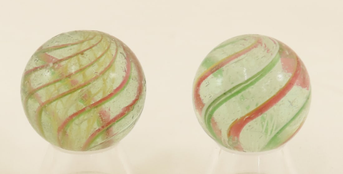 2 Vintage Latticino Marbles: 2 Vintage Latticino Marbles - 1 3/16 Inch White Latticino, Near Mint.1 1/4 Inch Yellow Latticino With Minor Nicks Photos are part of the description. Live Auctioneers only shows 20 photos per lot, Pro