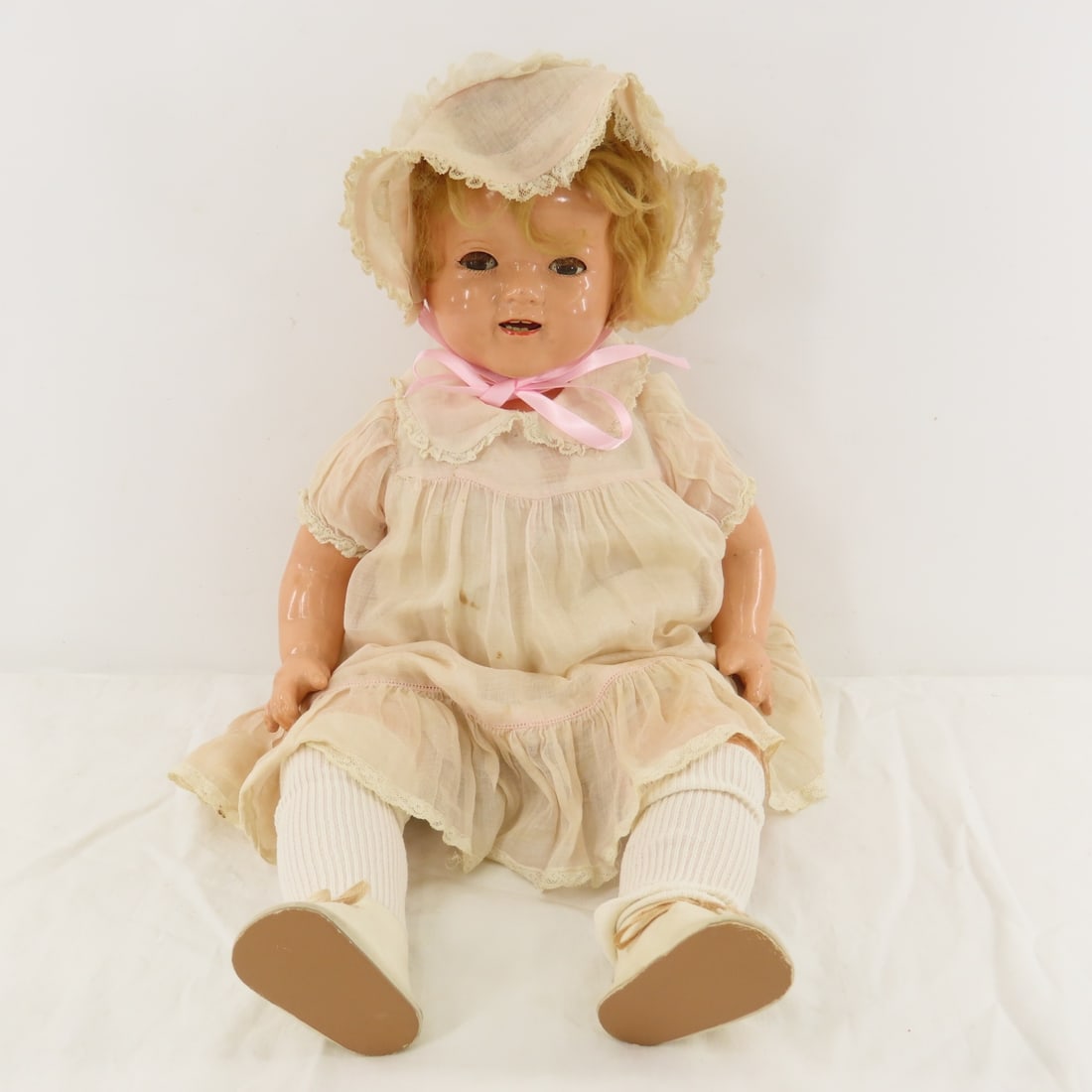 1930's Shirley Temple 20" Wigged Baby Doll: 1930's Shirley Temple 20" Wigged Baby Doll - molded hair under wig, back of head mark is very faint, shoulder head, sleep eyes with lashes, open mouth with 2 upper and 3 lower teeth, outfit is era- so