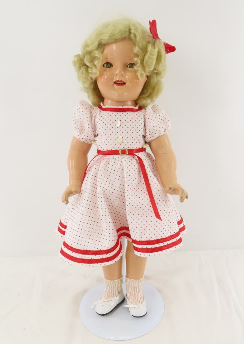 1930's Ideal 18" Shirley Temple Compo Doll: 1930's Ideal 18" Shirley Temple Compo Doll - back of head marked "SHIRLEY TEMPLE", replacement wig, back is marked "SHIRLEY TEMPLE 18". some crazing and cracking, open mouth with teeth, sleep eyes wit