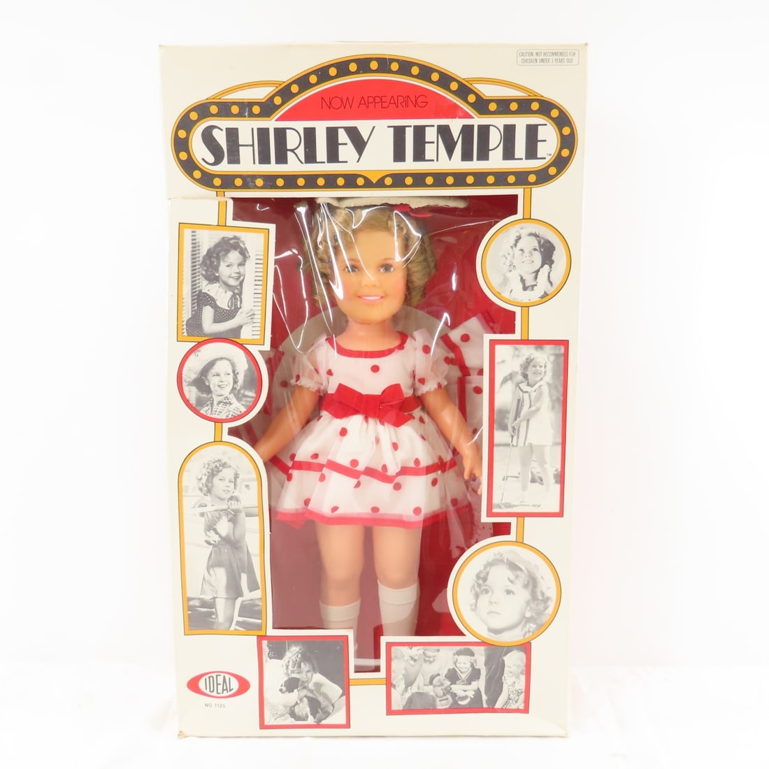 1973 Ideal Shirley Temple Stand Up and Cheer Doll: 1973 Ideal Shirley Temple Stand Up and Cheer Doll - 16" vinyl doll, No. 1125. Doll has not been removed from original marquee picture box (has some damage). Photos are part of the description. Live Au
