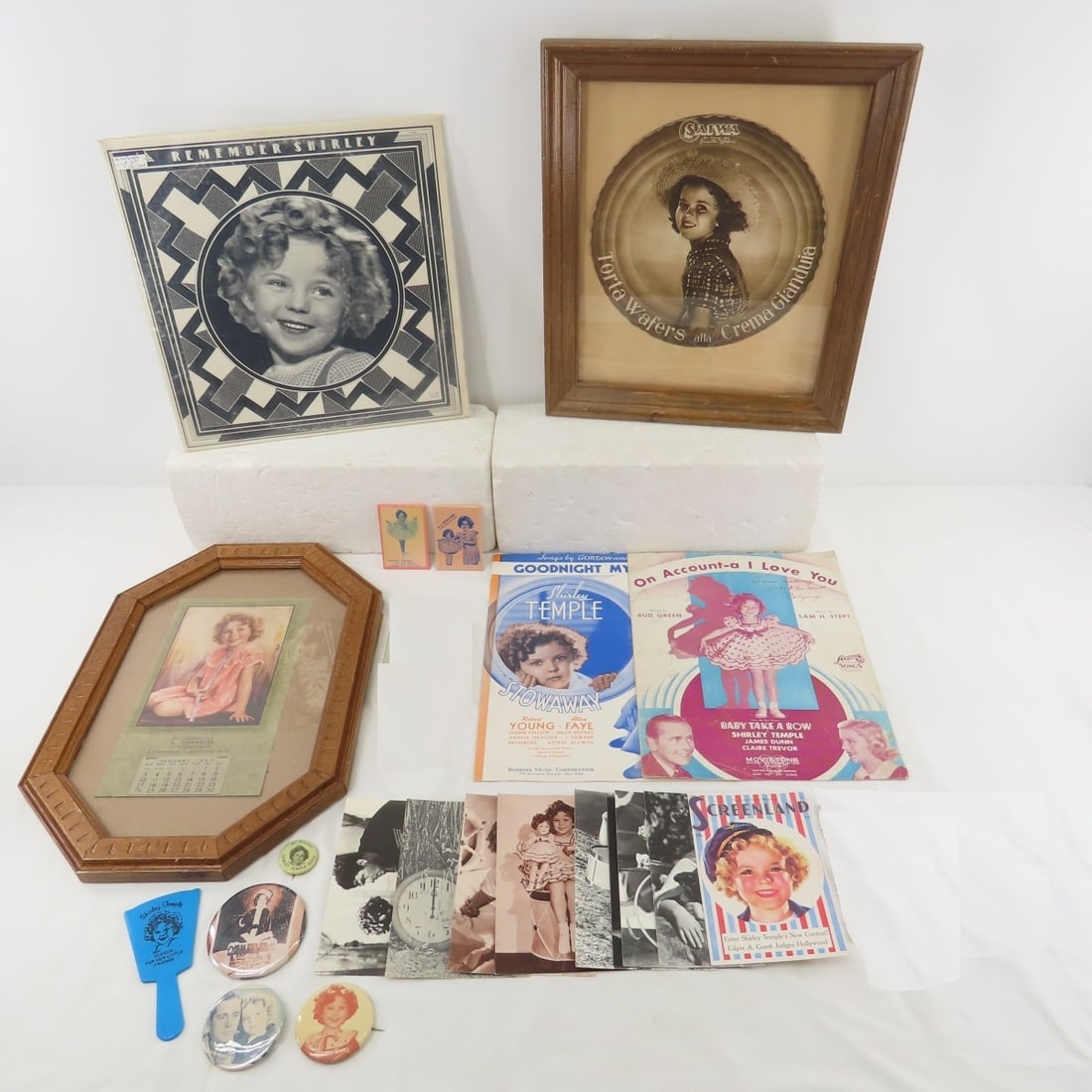 Shirley Temple Ads, Postcards, Record & More: Shirley Temple Ads, Postcards, Record & More - Saiwa 9" wafer ad in frame 13x15", 1937 Calendar 6x10" in frame 11 1/4 x 16 1/4", 1973 Remember Shirley 2 LP set with sleeves- in good condition, 2 sheet