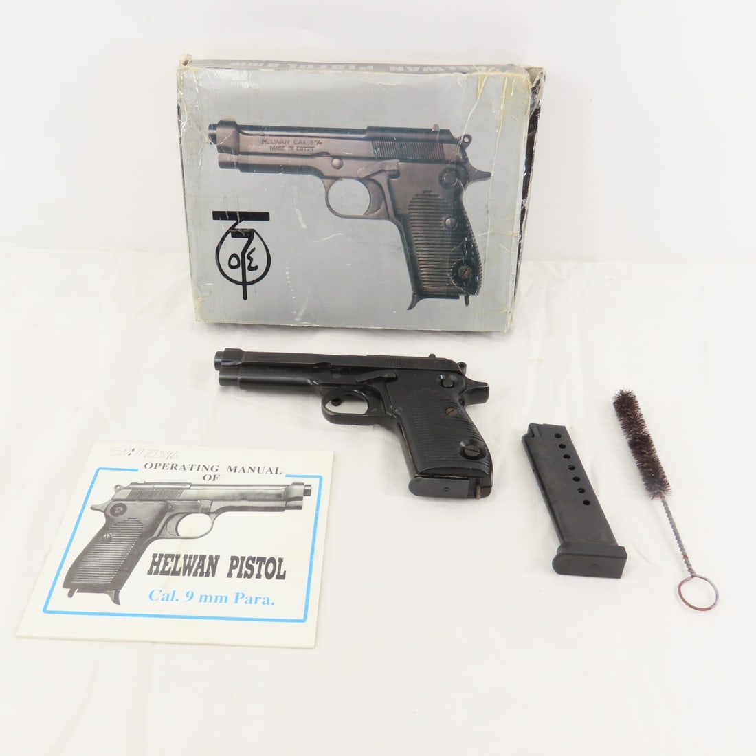 Helwan Egyptian Brigadier 9mm Para Pistol: Helwan Egyptian Brigadier 9mm Para Pistol - SN# 1170396, made in Egypt by Maadi Co for Engineering Industries, imported by CAI Georgia, VT. 4.5" barrel, iron sights, black synthetic grips, with 2 8 ro