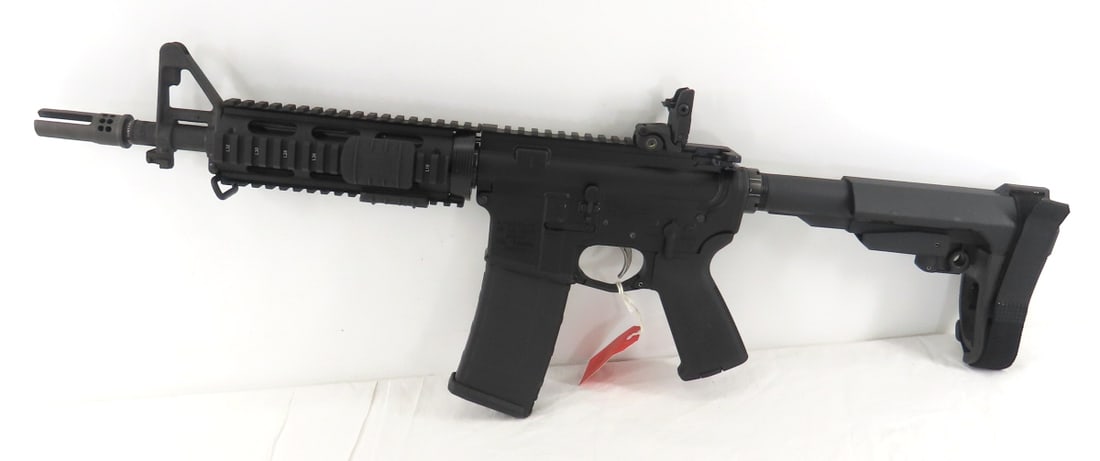 Palmetto State US M16A4 5.56mm Pistol with case: Palmetto State US M16A4 5.56mm Pistol with case - SN# 20002753, 10" barrel, WARCOMP SUREFIRE LLC flash hider, UTC quad rail, MBUS Sight, Magpul pistol grip, PSA stabilizer, 1 30 round PMAG, and case.