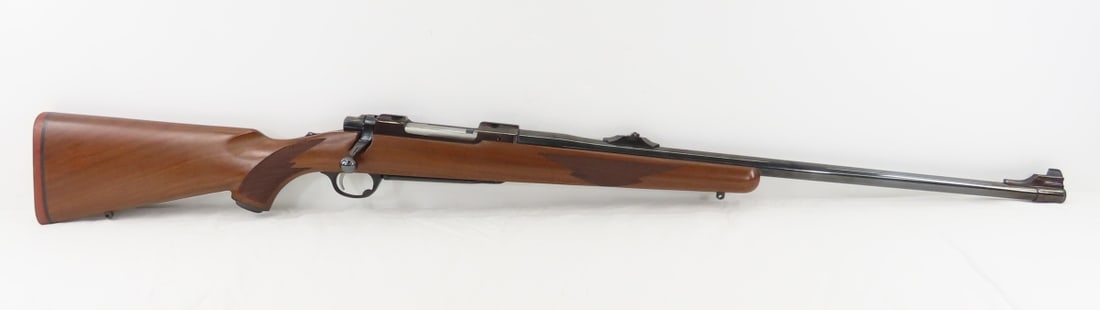Ruger M77.338 WIN MAG Bolt Action Rifle: Ruger M77.338 WIN MAG Bolt Action Rifle - SN# 772-15831, model 00756, 24" barrel, adjustable front blade sight and rear adjustable wing sight, checkered wood pistol grip stock with medallion and rubbe