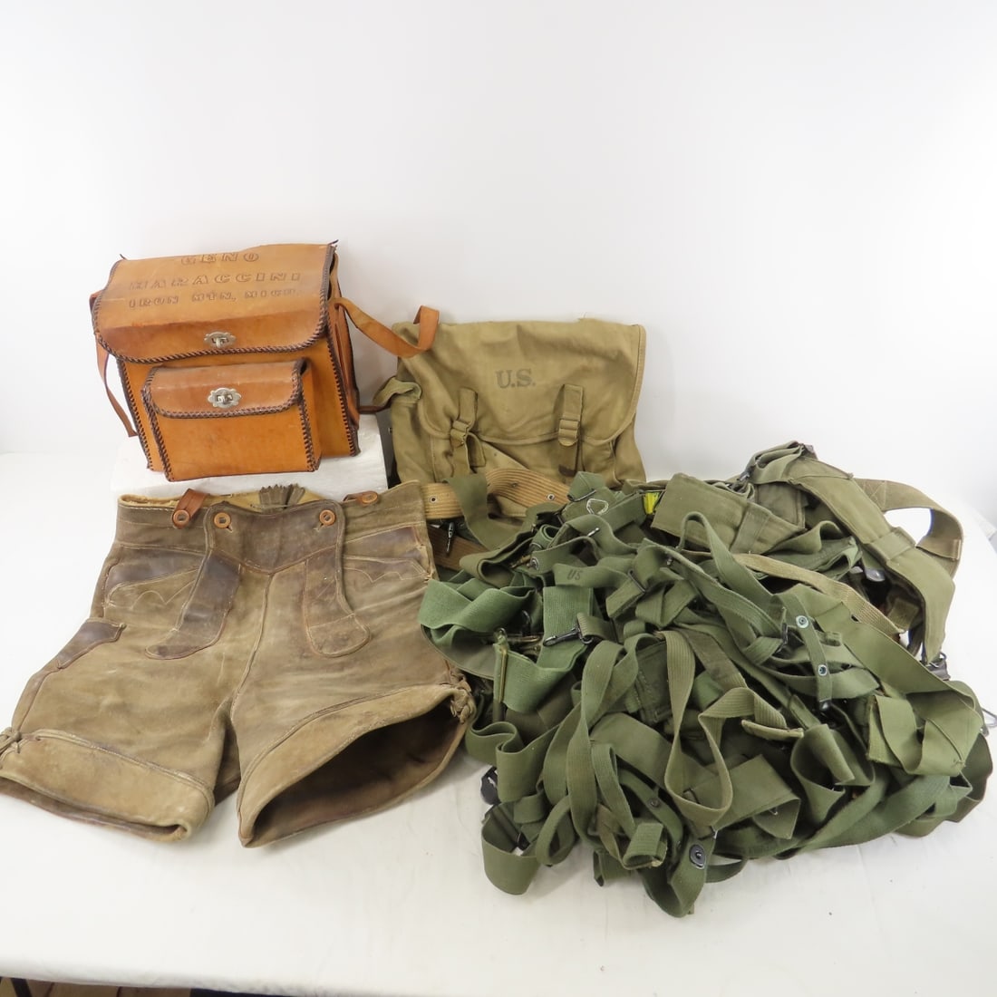 US military straps, packs and more: US military straps, packs and more - Photos are part of description. Please ask questions and read terms & conditions before bidding.