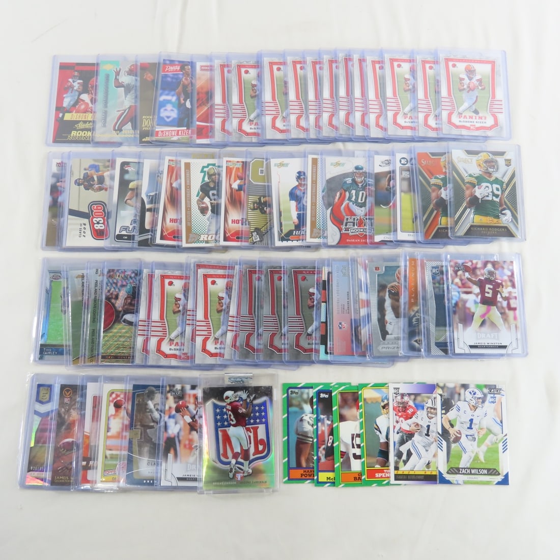 60+ Modern Football Cards with Rookies & Stars: 60+ Modern Football Cards with Rookies & Stars - Photos are part of description- Live Auctioneers only shows 20 photos per lot, if there are more you can view them on Proxibid or bidding app. Please a