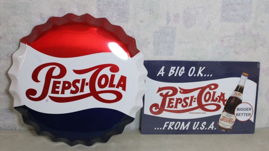 2 Pepsi Cola Advertising Metal Signs: 2 Pepsi Cola Advertising Metal Signs - Bottle Cap Pepsi Cola Soda metal sign measures 19" in diameter and Rectangular Pepsi Cola Soda metal sign measures about 18" x 12" (New in Cellophane).. Photos a