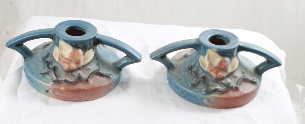 Roseville Pair 1156 Candle Holders Magnolia: Roseville Pair 1156 Candle Holders Magnolia - 2 1/2". Photos are part of description- Live Auctioneers only shows 20 photos per lot, if there are more you can view them on Proxibid or bidding app. Ple