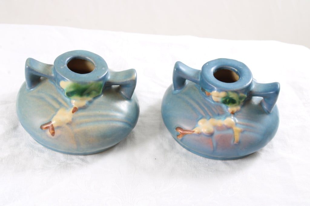 Pair Roseville Snowberry Candle Holders Blue: Pair Roseville Snowberry Candle Holders Blue - . Photos are part of description- Live Auctioneers only shows 20 photos per lot, if there are more you can view them on Proxibid or bidding app. Please a