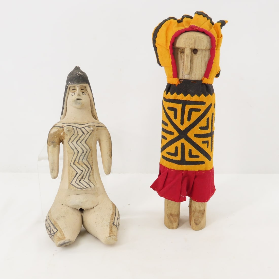 Brazilian Karaja Tribal Figure & Panama Guna Doll: Brazilian Karaja Tribal Figure & Panama Guna Doll - Clay figure from Brazilian, Karaja tribe in Amazon 9" tall, Handcrafted Wood & Cloth Guna Yala Doll from Panama 10.5", Lot size: 11 x 8 x 5", 3 lbs
