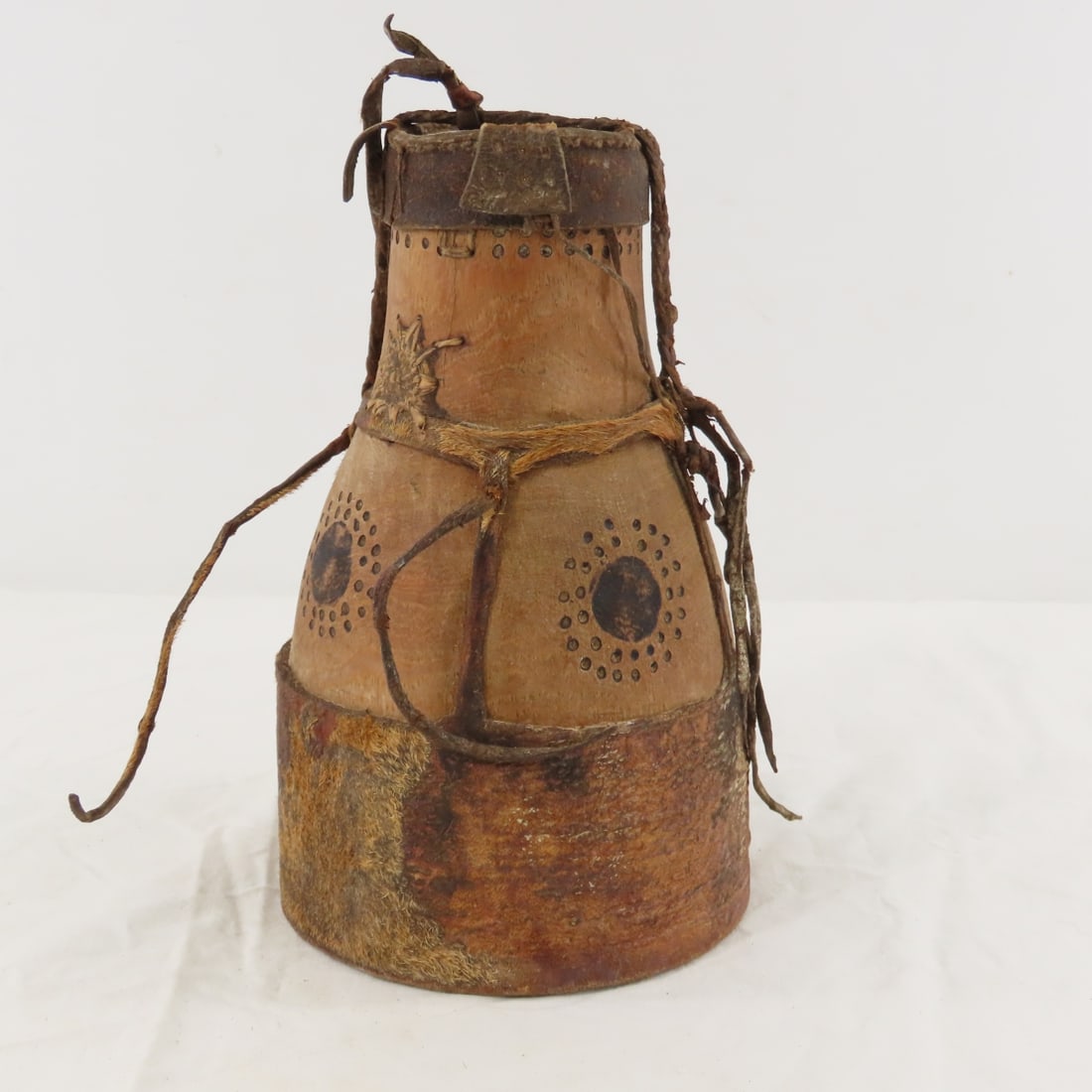 Kenyan, African Turkana Eburi Milk/Fat Gourd Jug: Kenyan, African Turkana Eburi Milk/Fat Gourd Jug - Animal hide stretched over Gourd, 9" tall, Lot size: 10 x 6 x 7", 2 lbs Photos are part of lot description. Please ask questions and read terms & con
