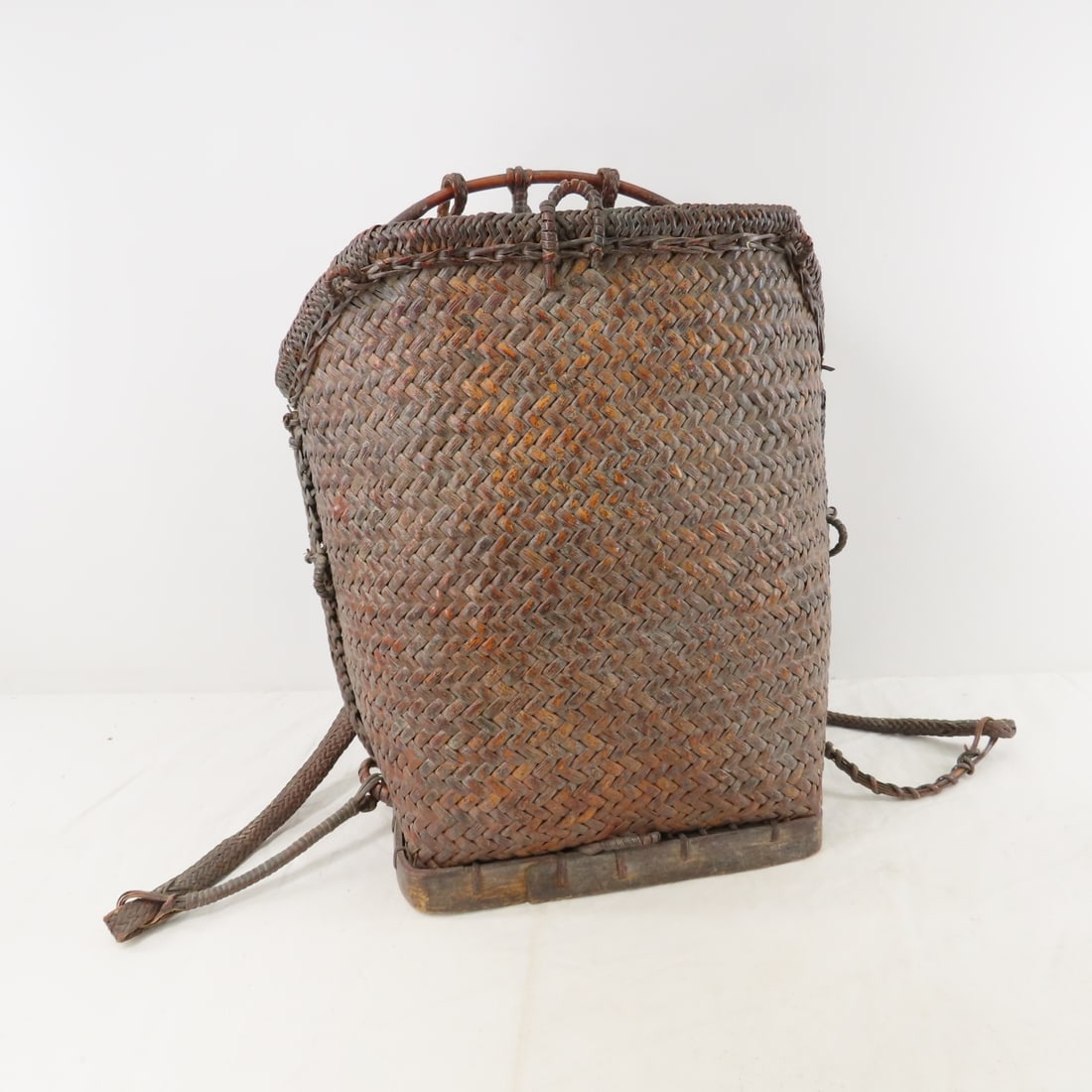 Southeast Asian Hand Woven Wicker Backpack: Southeast Asian Hand Woven Wicker Backpack - 18" tall, Lot size: 20 x 15 x 14", 4 lbs Photos are part of lot description. Please ask questions and read terms & conditions before bidding.