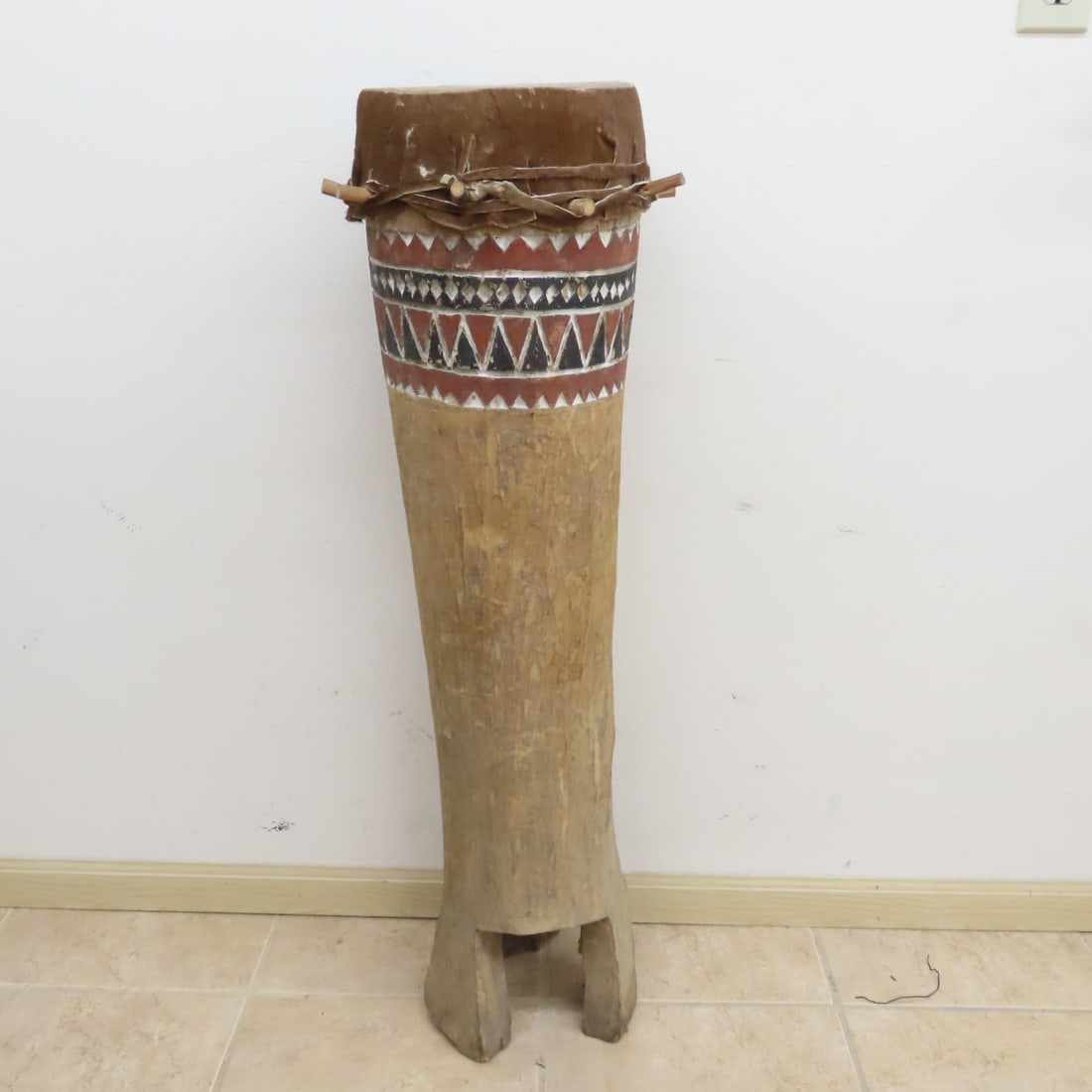 Hand Carved West African Tonga Drum: Hand Carved West African Tonga Drum - 39" tall, 10" skin, Lot size: 13 x 13 x 42", 24 lbs Photos are part of lot description. Please ask questions and read terms & conditions before bidding.