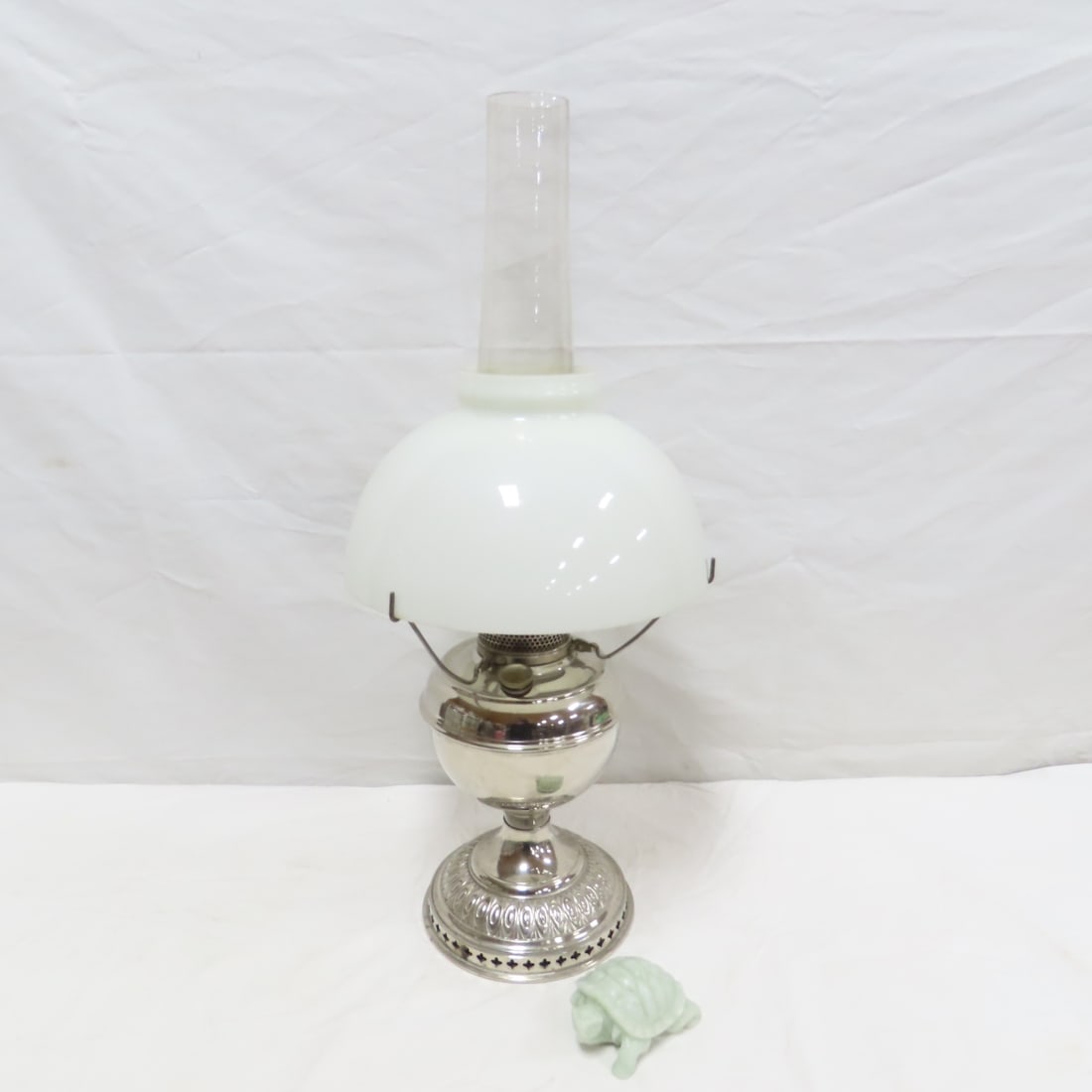 Antique Plume & Atwood Nickel Plated Oil Lamp: Antique Plume & Atwood Nickel Plated Oil Lamp - Unmarked, Probable Plume & Atwood lamp, B&H Font, Hand Carved Jade Turtle. Lamp is 23" tall, Lot size: 18 x 15 x 9", 5 lbs Photos are part of lot descri