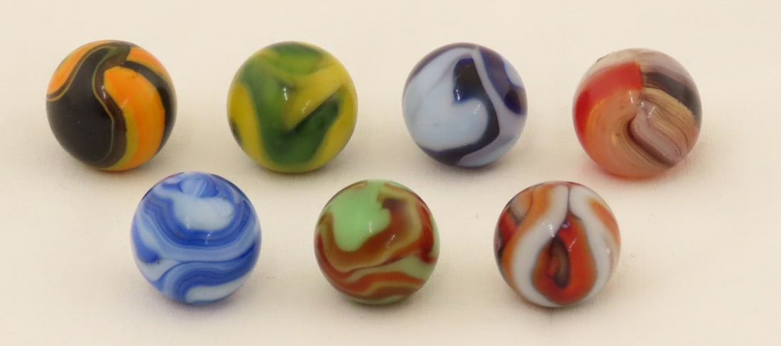 7 Vintage West Virginia Swirl Marbles: 7 Vintage West Virginia Swirl Marbles - Lot Size 3x3x3" 1lbPhotos are part of description. Please ask questions and read terms & conditions before bidding.