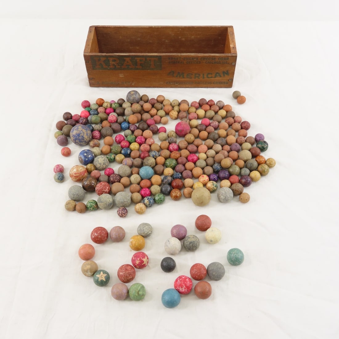 Collection of vintage Clay marbles in cheese box: Collection of vintage Clay marbles in cheese box - Lot Size 5x5x12" 4lbPhotos are part of description. Please ask questions and read terms & conditions before bidding.