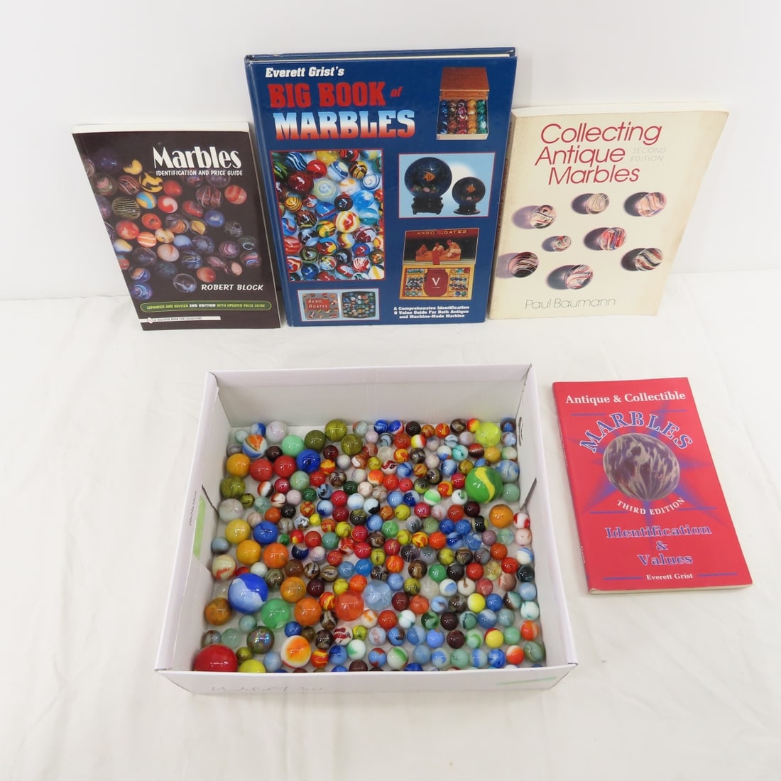 Contemporary & Vintage Marbles & Marble books: Contemporary & Vintage Marbles & Marble books - Lot size 12x12x10" 10lbPhotos are part of description. Please ask questions and read terms & conditions before bidding.