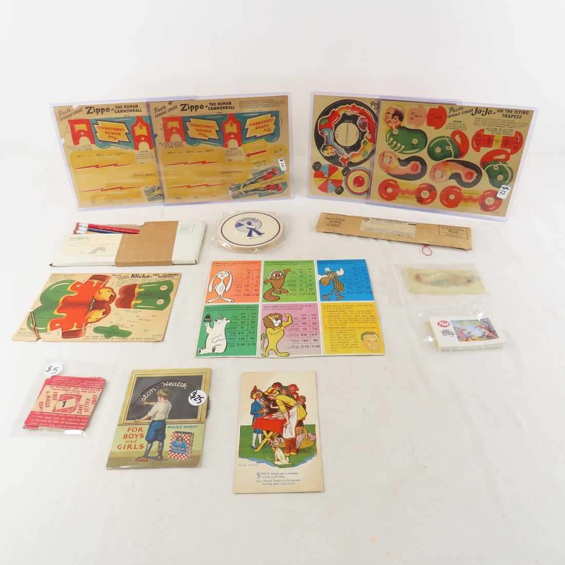 Post Cereal & Other Premiums and Ephemera: Post Cereal & Other Premiums and Ephemera - 5 Posts Zippo's Circus cut outs- unpunched, Yours truly Radios Johnny Dollars pencils, Butter Nut bread card, Moore milk coasters, Post Toasties Olive Oyl r