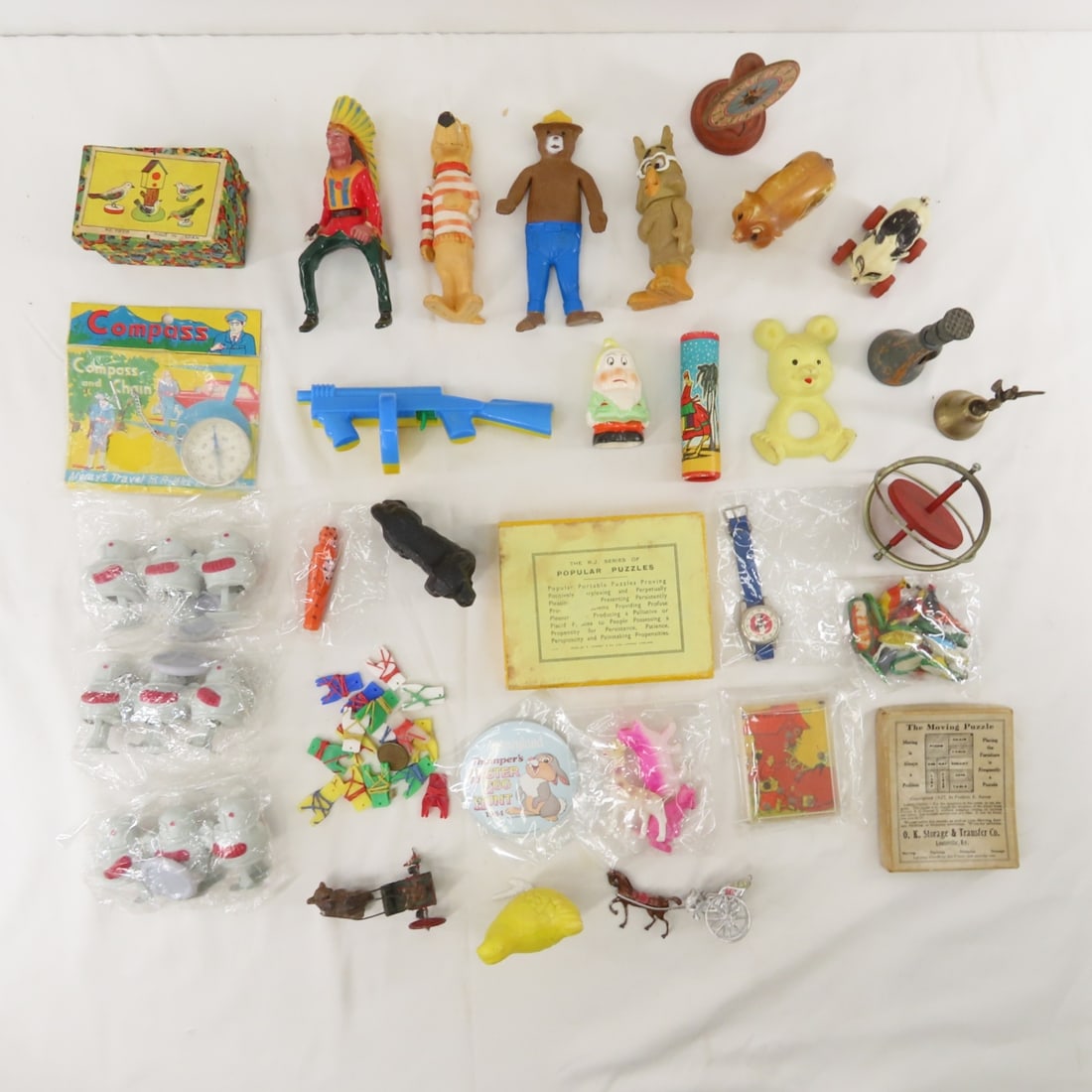 Vintage plastic toys, Rail Walkers, Animals & more: Vintage plastic toys, Rail Walkers, Animals & more - Cake toppers, compass, and more. Lot size: 11 x 10 x 10", 5.9 lbsPhotos are part of description. Please ask questions and read terms & conditions b