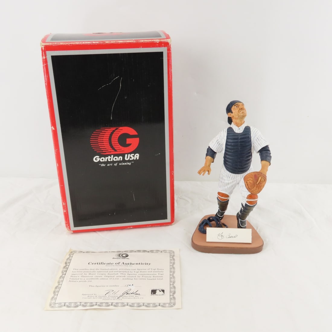 Yogi Berra Autographed LE Figurine #1902/2150: Yogi Berra Autographed LE Figurine #1902/2150 - Gartlan USA Inc. Certificate of Authenticity and original box. Lot Size 13x7x9" 2lbPhotos are part of description. Please ask questions and read terms &