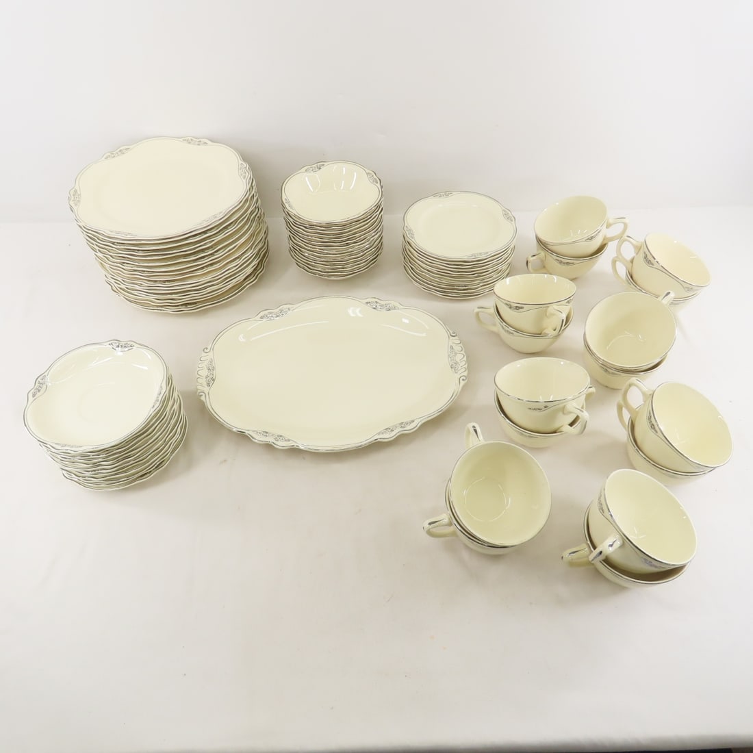 34 Piece Homer Laughlin Virginia Rose Dish Set: 34 Piece Homer Laughlin Virginia Rose Dish Set - Several plates and saucers have 'flea bites' or small chips. Largest platter 13", 15x bowls, 12x small plates, 12x saucers,18x plates, 16x coffee cups,