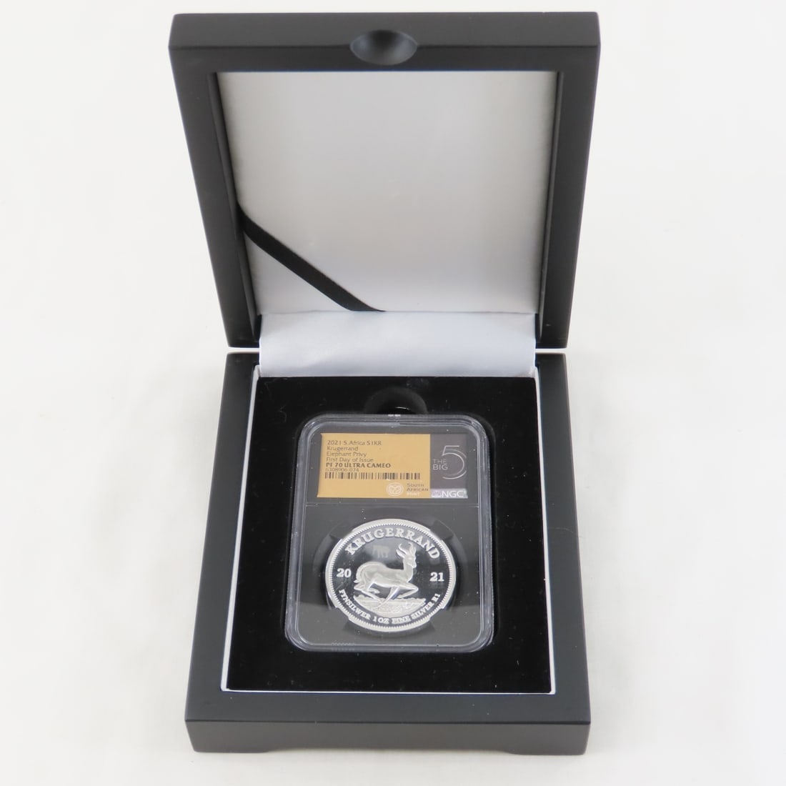 2021 S Africa Silver 1 Kroner NCG PF70 Ultra Cameo: 2021 S Africa Silver 1 Kroner NCG PF70 Ultra Cameo - Lot Size 4x3x2" 1 lb Photos are part of description, Live Auctioneers only displays the 1st 20 photos per lot. Please ask questions and read terms