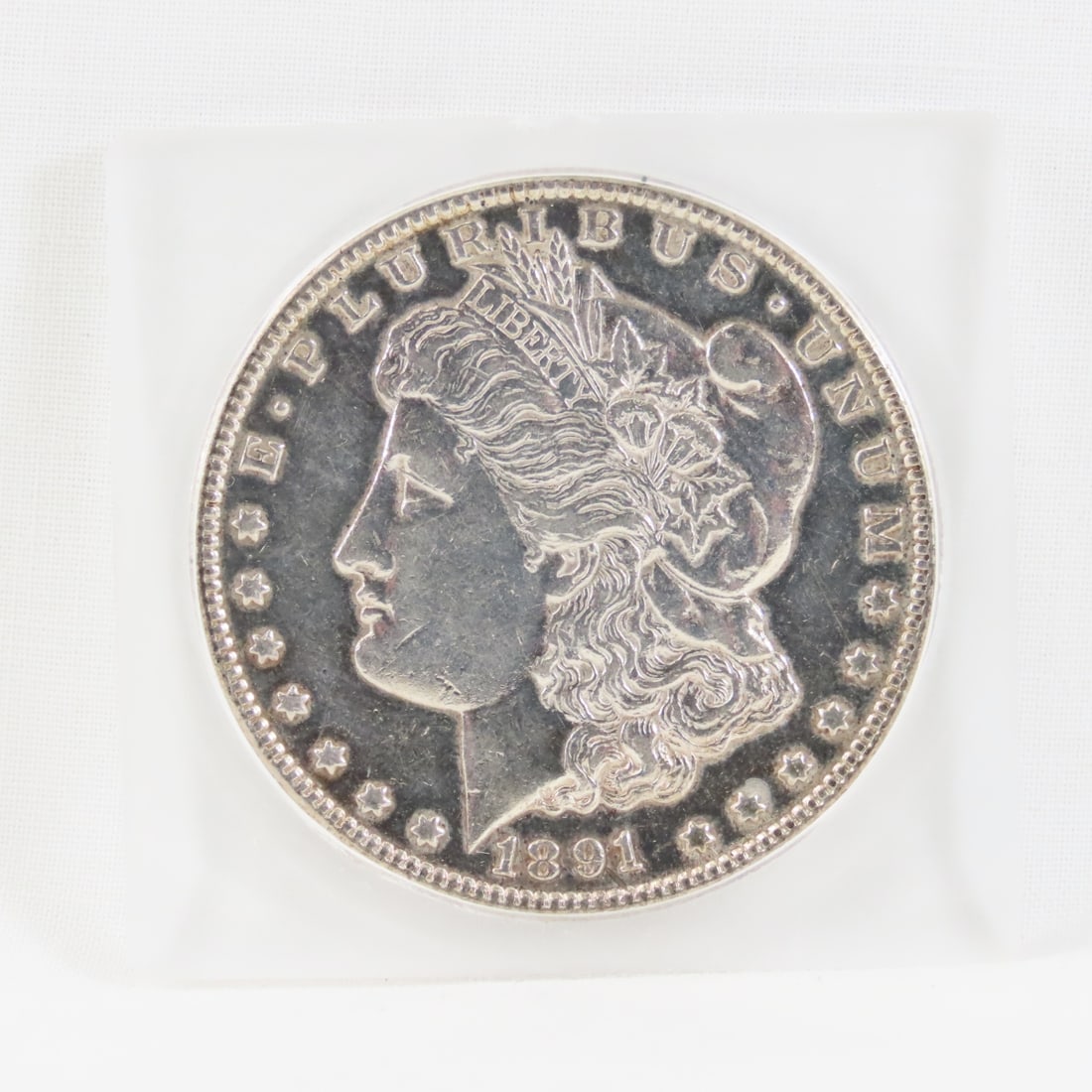 1891 CC Morgan Silver Dollar: 1891 CC Morgan Silver Dollar - Lot Size 3x2x1" 1lb Photos are part of description, Live Auctioneers only displays the 1st 20 photos per lot. Please ask questions and read terms & conditions before bid