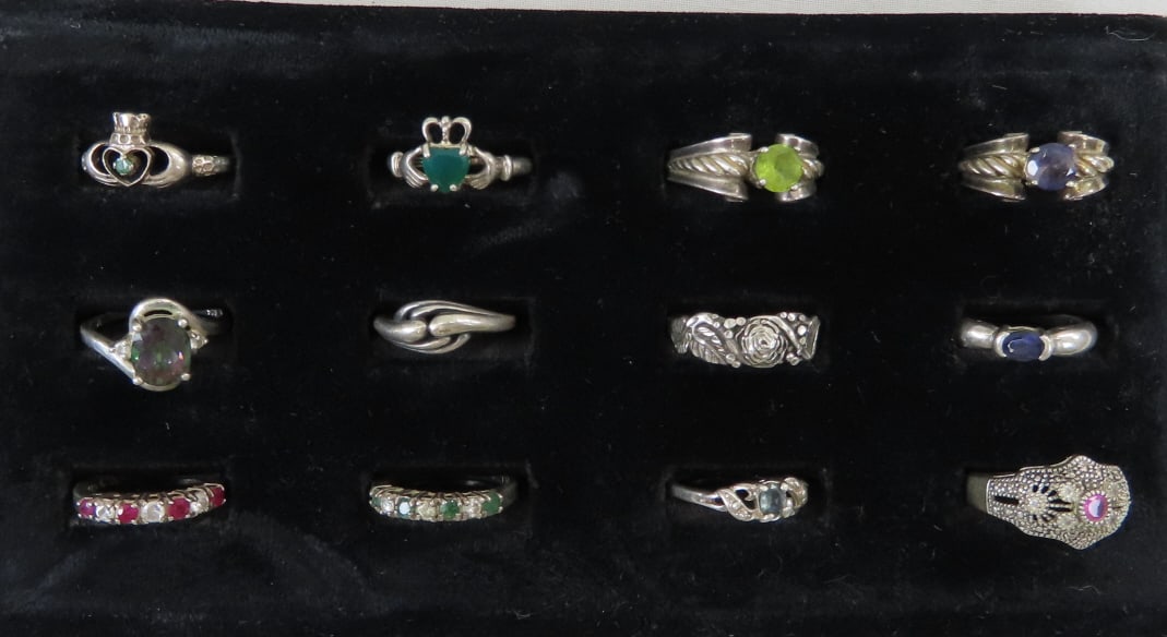12 Sterling & Semi-Precious Stone Rings: 12 Sterling & Semi-Precious Stone Rings - 33.1 grams total weight, all marked 925 or sterling non- magnetic 1) A mystic topaz size 6 1/2, 2) copyright hallmark emerald Claddagh size 8, 3) un hallmarke