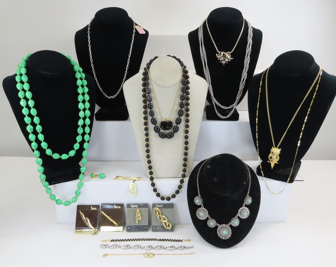 Vintage Signed Trifari Jewelry: Vintage Signed Trifari Jewelry - 2 green bead necklaces have only 1 matching earring, 4 brooches on cards, silver chain with original hang tag, and more. Lot size 8 x 8 x 8", 1.2 lbs Photos are part o