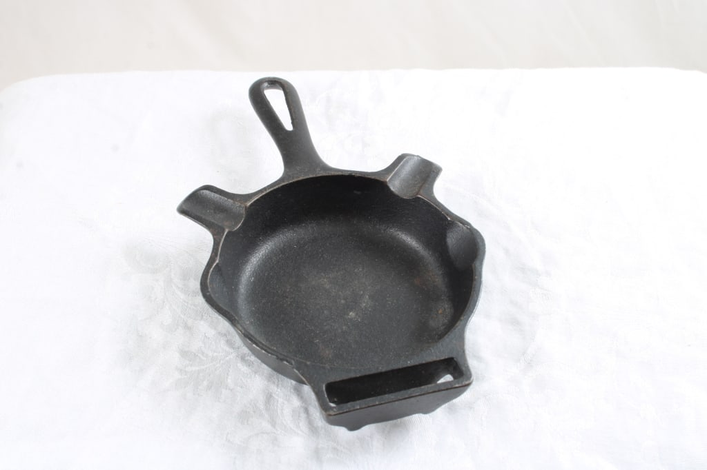 Griswold Cast Iron Skillet Ashtray w/Matchholder: Griswold Cast Iron Skillet Ashtray w/Matchholder - Lot Size is 7" x 5" x 3". 1 Lb. Photos are part of description (Live Auctioneers only shows up to 20). Please ask questions and read terms &