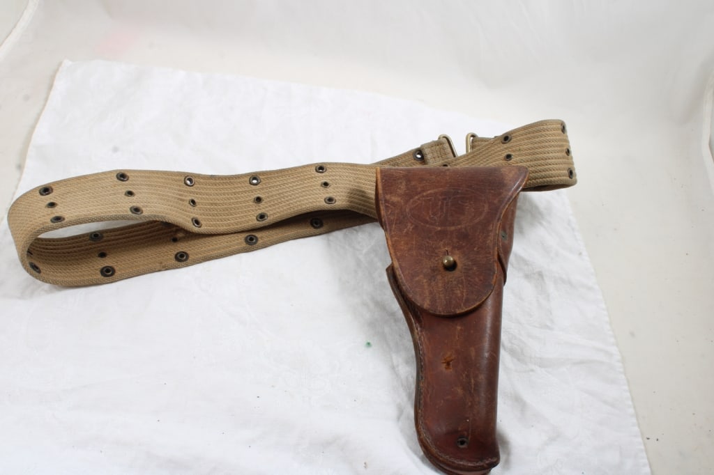 WW2 US Army Khaki Belt, Leather U.S. Holster: WW2 US Army Khaki Belt, Leather U.S. Holster - 1 Lb. 2 Oz. Lot Size 12" x 6" x 6". Photos are part of description (Live Auctioneers only shows up to 20). Please ask questions and read terms & conditio
