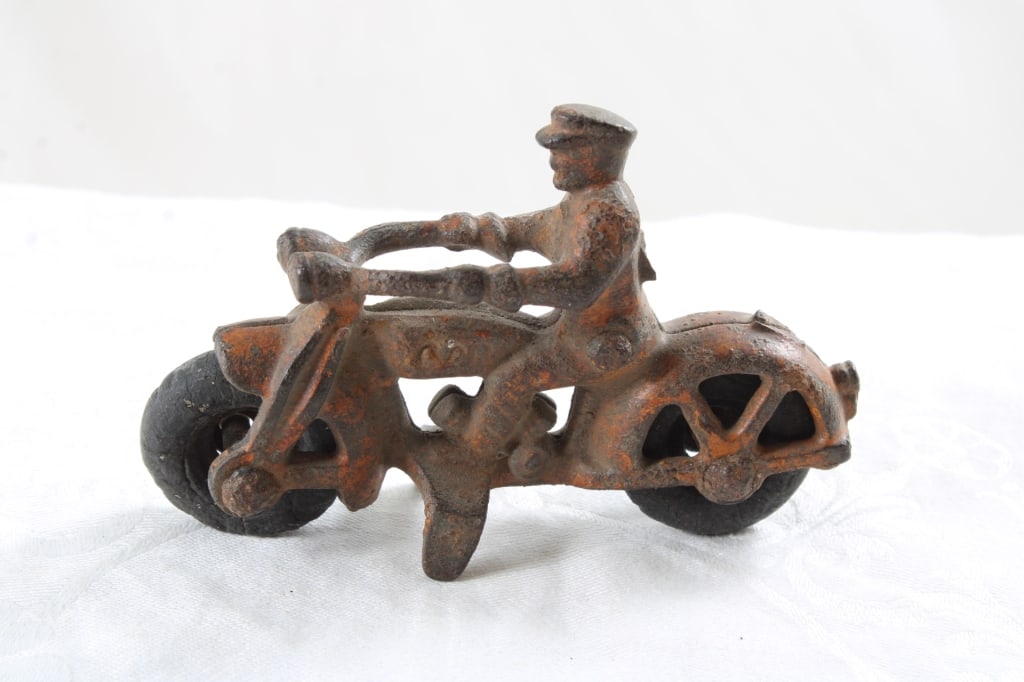 1930's Hubley Cast Iron Red Police Motorcycle: 1930's Hubley Cast Iron Red Police Motorcycle - 5 Oz. Lot size 4" x 2 1/2" x 1". Photos are part of description (Live Auctioneers only shows up to 20). Please ask questions and read terms & conditions