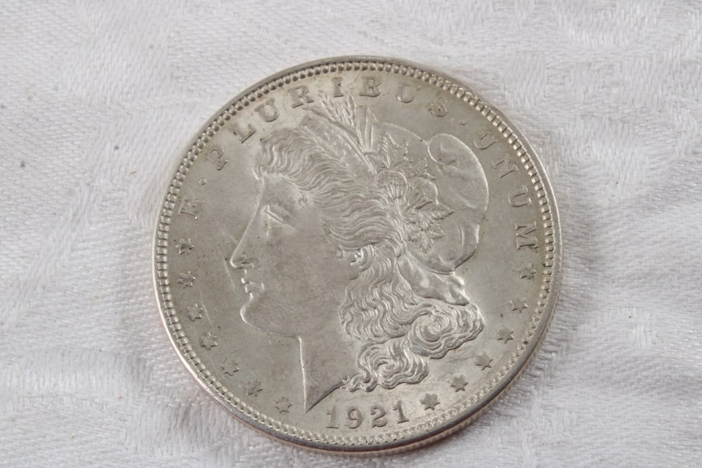 1921 Morgan Silver Dollar: 1921 Morgan Silver Dollar - 1 Oz. Lot Size 2" Diameter Photos are part of description (Live Auctioneers only shows up to 20). Please ask questions and read terms & conditions before bidding.