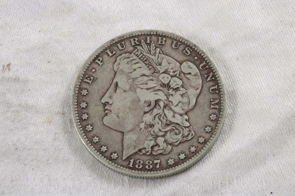 1887 O Morgan Silver Dollar: 1887 O Morgan Silver Dollar - 3 oz. 1.5" Diameter Photos are part of description (Live Auctioneers only shows up to 20). Please ask questions and read terms & conditions before bidding. 