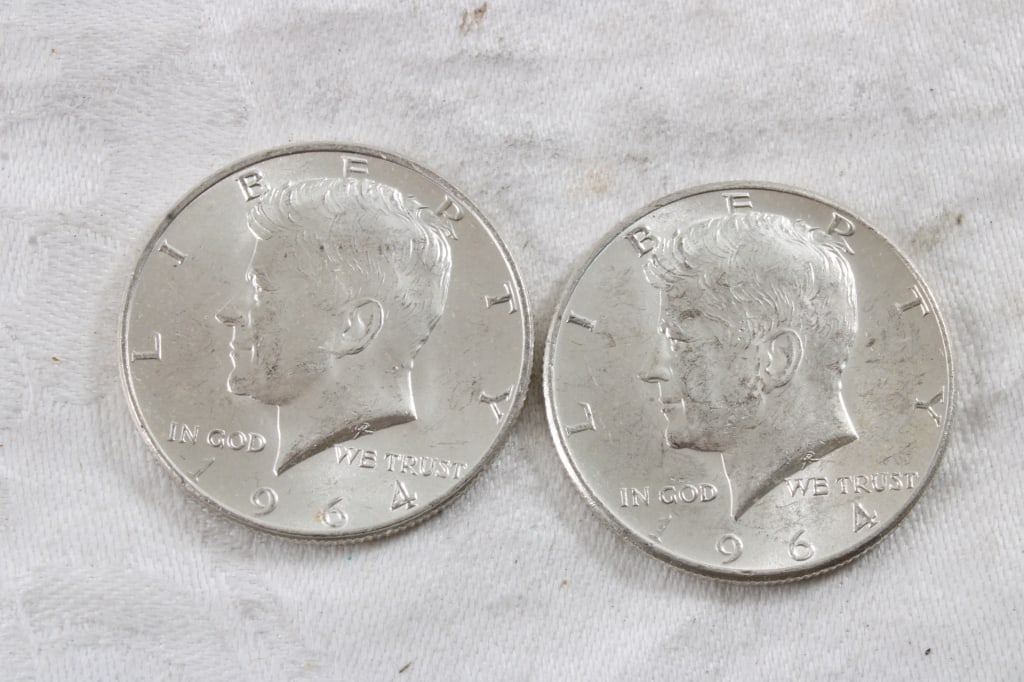 2 1964 JFK Silver Half Dollars: 2 1964 JFK Silver Half Dollars - 3 Oz. Lot Size 1.25" Diameter. Photos are part of description (Live Auctioneers only shows up to 20). Please ask questions and read terms & conditions before