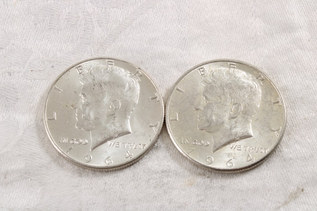 2 1964 JFK Silver Half Dollars: 2 1964 JFK Silver Half Dollars - 3 Oz. Lot Size 1.25" Diameter Photos are part of description (Live Auctioneers only shows up to 20). Please ask questions and read terms & conditions before bidding. 