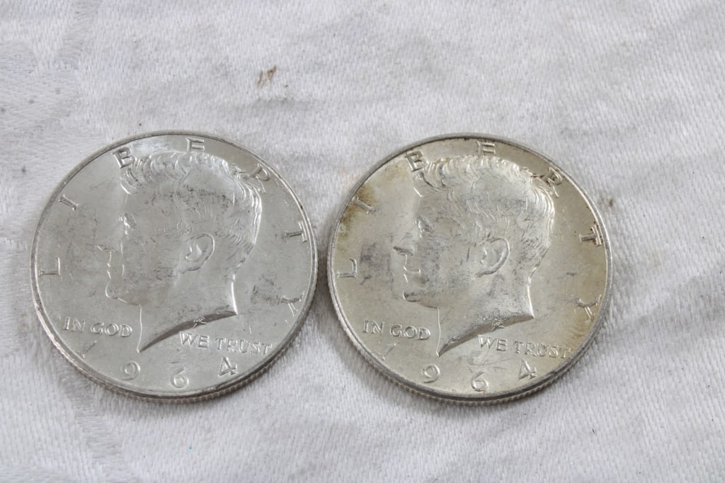 2 1964 JFK Silver Half Dollars: 2 1964 JFK Silver Half Dollars - 3 Oz. Lot Size 1.25" Diameter. Photos are part of description (Live Auctioneers only shows up to 20). Please ask questions and read terms & conditions before