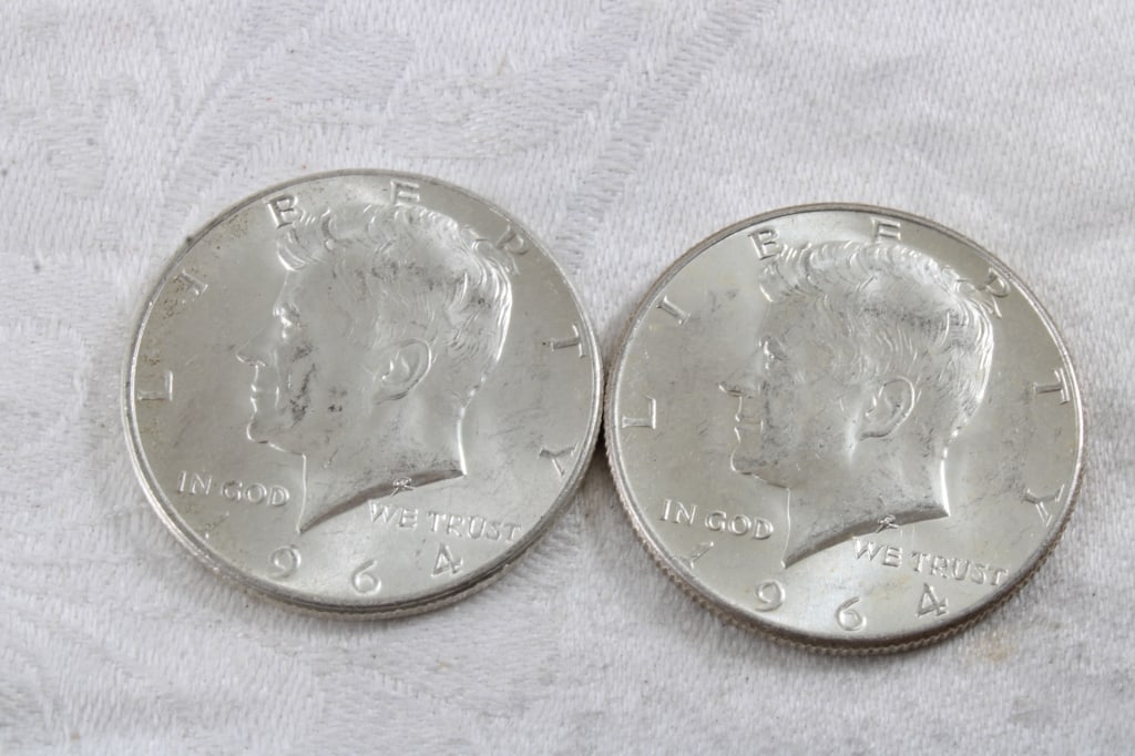 2 1964 JFK Silver Half Dollars: 2 1964 JFK Silver Half Dollars - 3 Oz. Lot Size 1.25" Diameter. Photos are part of description (Live Auctioneers only shows up to 20). Please ask questions and read terms & conditions before