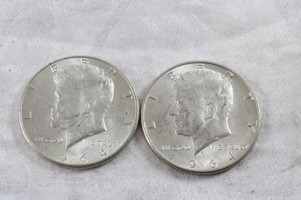 2 1964 JFK Silver Half Dollars: 2 1964 JFK Silver Half Dollars - 3 Oz. Lot Size 1.25" Diameter. Photos are part of description (Live Auctioneers only shows up to 20). Please ask questions and read terms & conditions before