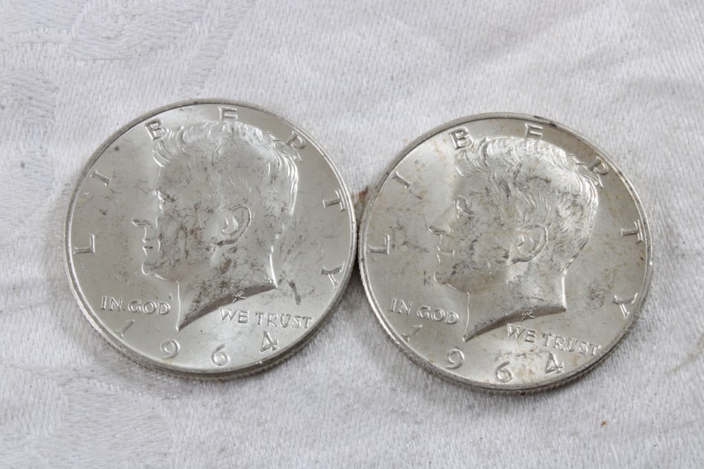 2 1964 JFK Silver Half Dollars: 2 1964 JFK Silver Half Dollars - 3 Oz. Lot Size 1.25" Diameter. Photos are part of description (Live Auctioneers only shows up to 20). Please ask questions and read terms & conditions before