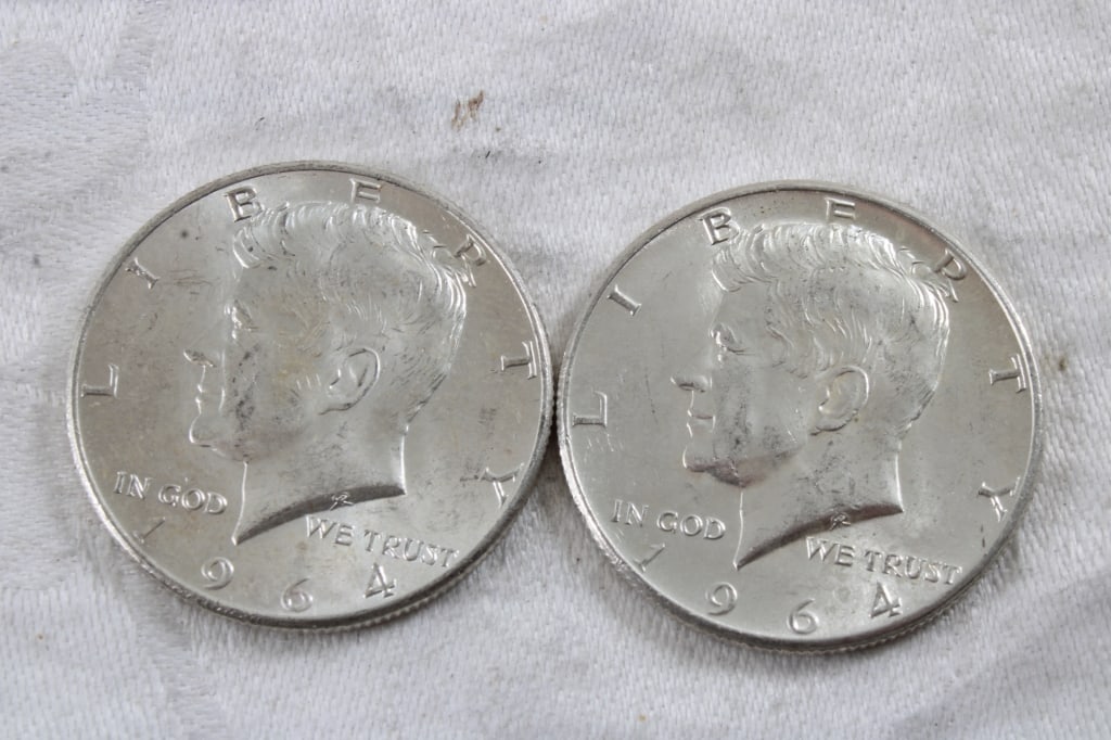 2 1964 JFK Silver Half Dollars: 2 1964 JFK Silver Half Dollars - 3 Oz. Lot Size 1.25" Diameter. Photos are part of description (Live Auctioneers only shows up to 20). Please ask questions and read terms & conditions before