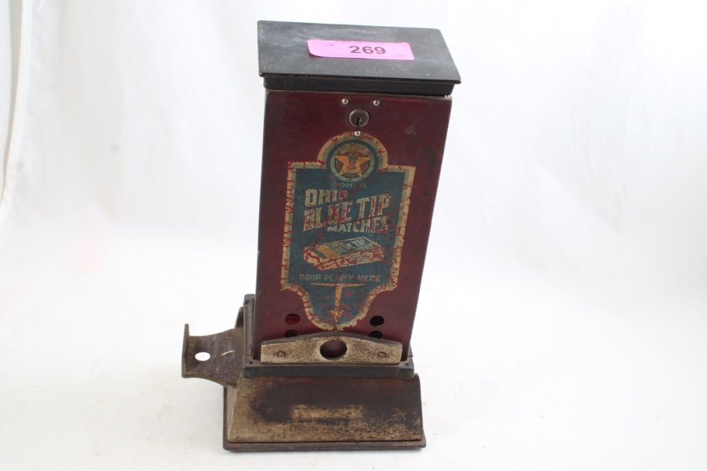 Ohio Blue Tip Matches Coin-Op Vending Machine: Ohio Blue Tip Matches Coin-Op Vending Machine - One Cent Match Vending Machine by Ohio Blue Tip Matches. There are coins inside along with matches contents. No Key. 9 Lbs. Lot Size 12" x 6"