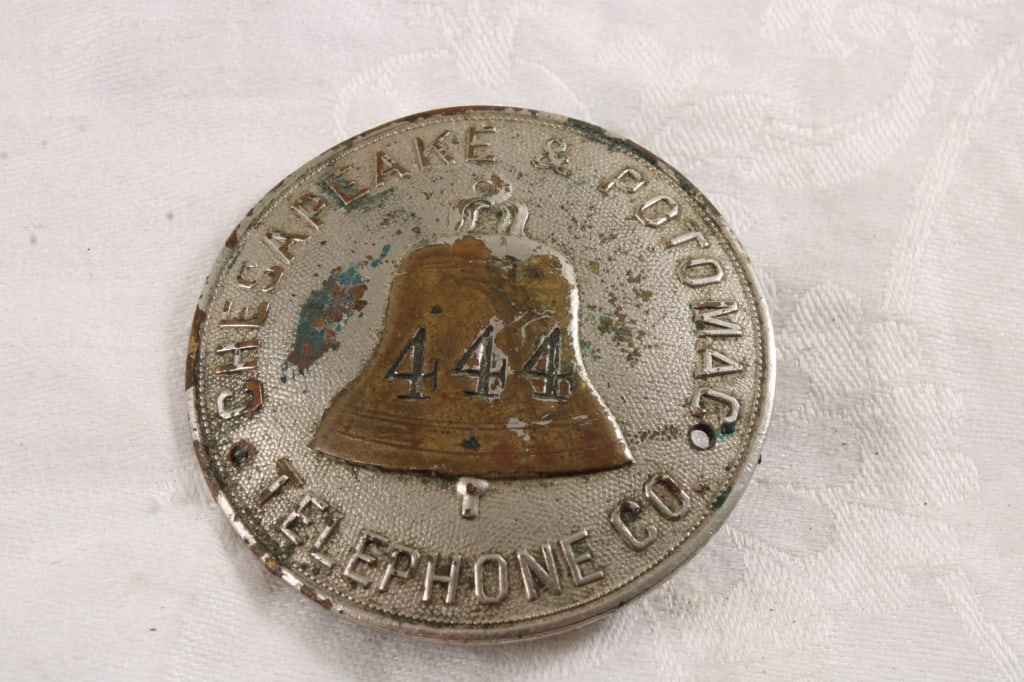 Chesapeake & Potomac Tele. Employee Badge 444: Chesapeake & Potomac Tele. Employee Badge 444 - Badge Pin #444. 3 Oz. Lot Size 2" Diameter. Photos are part of description (Live Auctioneers only shows up to 20). Please ask questions and read