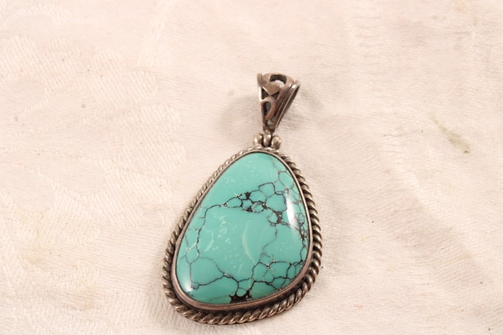 Sterling Silver Turquoise Signed Pendant: Sterling Silver Turquoise Signed Pendant - Artist Signed. 9 Grams. 2 Oz. Lot Size 2" x 1". Photos are part of description (Live Auctioneers only shows up to 20). Please ask questions and read