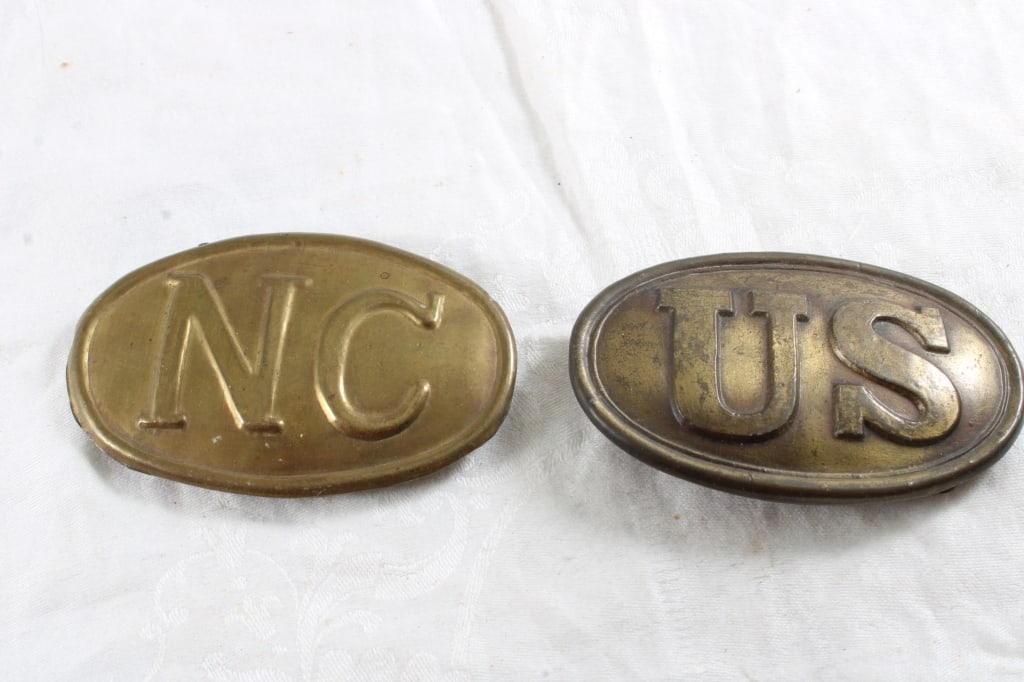 2 US Civil War Era Brass Belt Buckles: 2 US Civil War Era Brass Belt Buckles - North Carolina and U.S. I can see the US buckle is not a period piece but am not sure of North Carolina one. 1 Lb. Lot Size 4" x 3" x 2". Photos are
