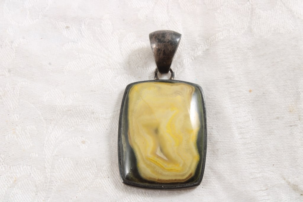 Bumble Bee Jasper & Sterling Pendant 18.8 Grams: Bumble Bee Jasper & Sterling Pendant 18.8 Grams - 2 Oz. Lot Size 3" x 2" x 1". Photos are part of description (Live Auctioneers only shows up to 20). Please ask questions and read terms & conditions b