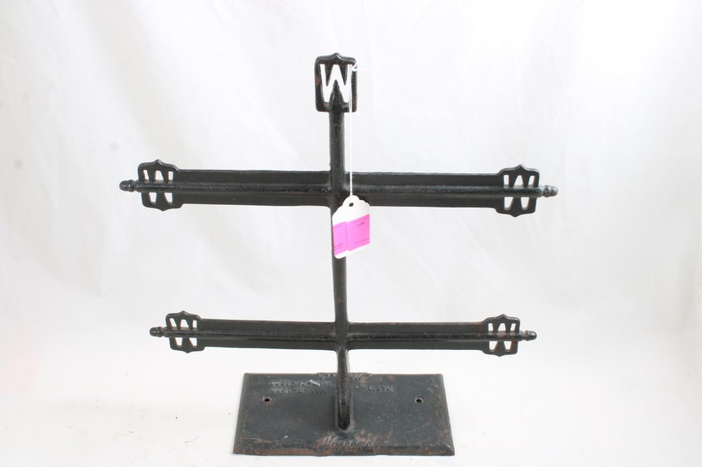 Warrens General Store Cast Iron Display Rack: Warrens General Store Cast Iron Display Rack - 3 Lbs. Lot Size 13" x 13" x 4". Photos are part of description (Live Auctioneers only shows up to 20). Please ask questions and read terms & conditions b