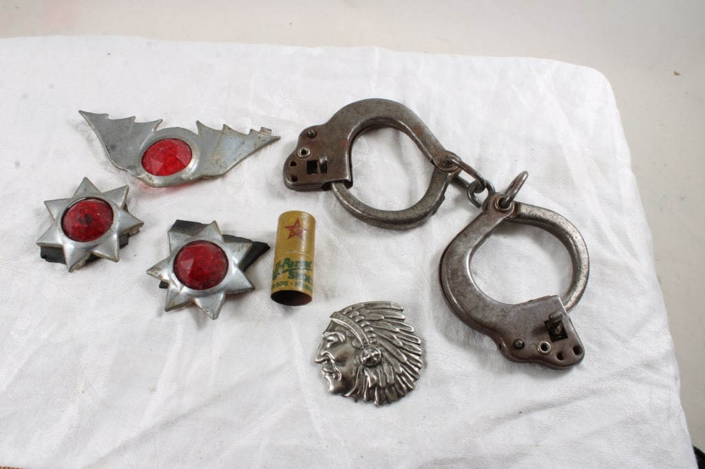 Children's Vintage Toys Handcuffs, Bike Reflectors: Children's Vintage Toys Handcuffs, Bike Reflectors - Native American Pin, Poll Parrot Whistle. 12 Oz. Lot Size 6" x 6" x 6". Photos are part of description (Live Auctioneers only shows up to 20).