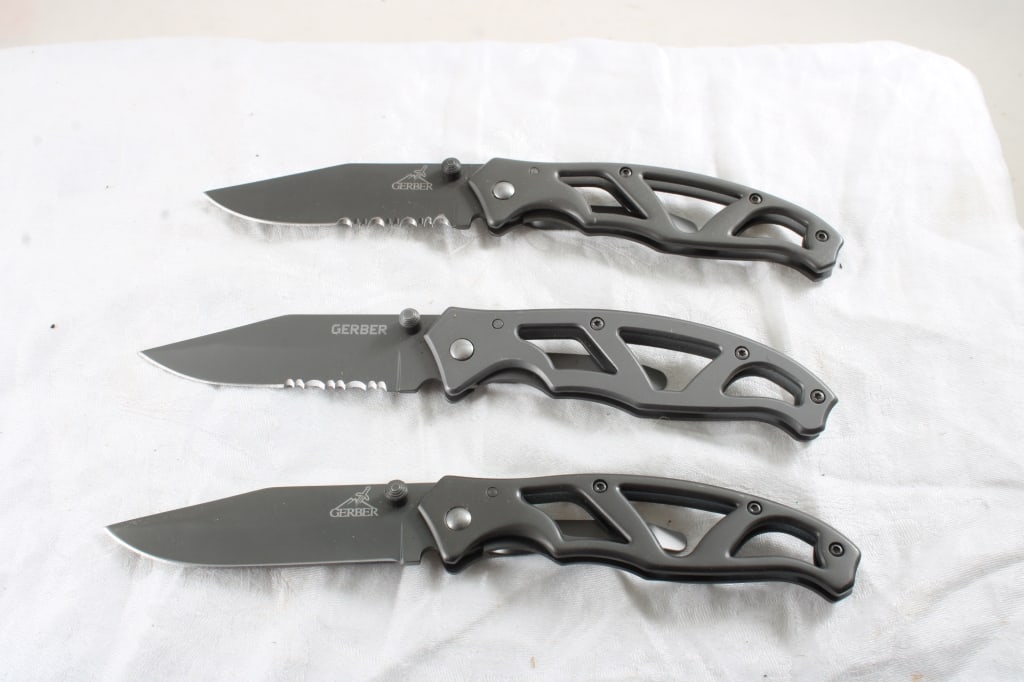 3 Gerber Folding Lock Blade Knives: 3 Gerber Folding Lock Blade Knives - 12 Oz. Lot Size 6" x 6" X 2". Photos are part of description (Live Auctioneers only shows up to 20). Please ask questions and read terms & conditions before biddin